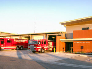 A joint fire station with Ventura County, fire station 7 has 6 large garage doors with engine 67 and haz-mat 67 parked in the driveway.